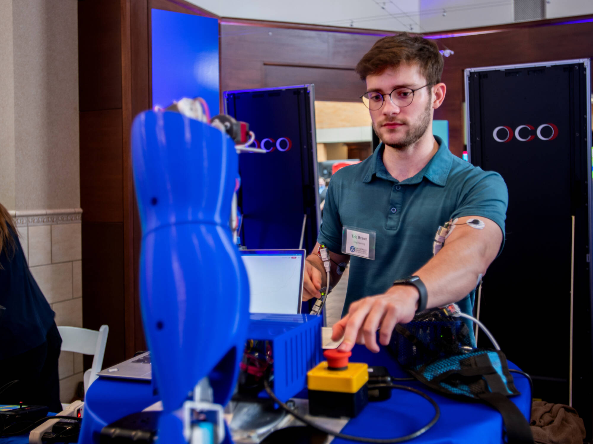 Eric Braun, a GVSU engineering alumnus, showcases his work during booths showcasing “The Transformative Power of Students Research and Creativity” during the Reach Higher Celebration April 17.
